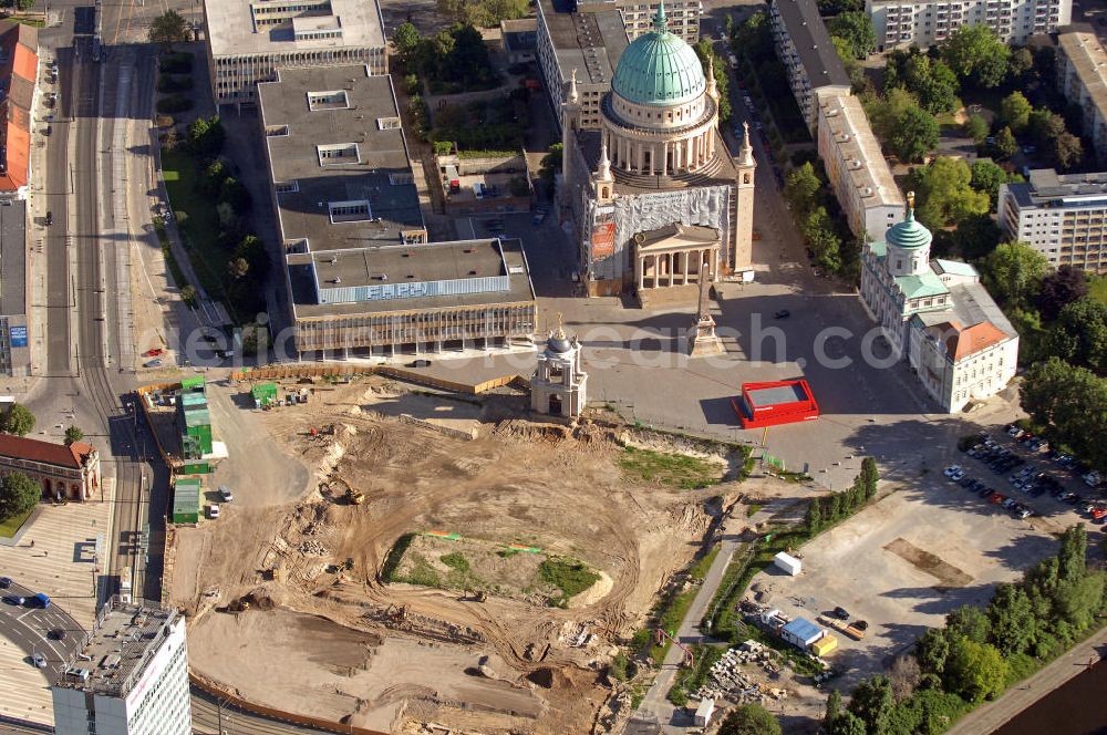 Aerial photograph Potsdam - Blick auf die Baustelle des Potsdamer Stadtschlosses am Alten Markt. Ein Neubau des Brandenburger Landtages auf dem Gelände des Stadtschlosses ist beschlossen, der ersten Spatenstich erfolgte im März 2010. Im Hintergrund befindet sich die Fachhochschule Potsdam und die St. Nikolaikirche. Bauausführendes Unternehmen: BAM Deutschland AG. View of the construction site of the Potsdam Stadtschloss at the Old Market. A new building of the Brandenburg state parliament on the grounds of the Stadtschloss is decided, the ground-breaking ceremony took place in March 2010. In the background is the University of Applied Sciences Potsdam and St. Nikolai Church. Building contractors company: BAM Deutschland AG