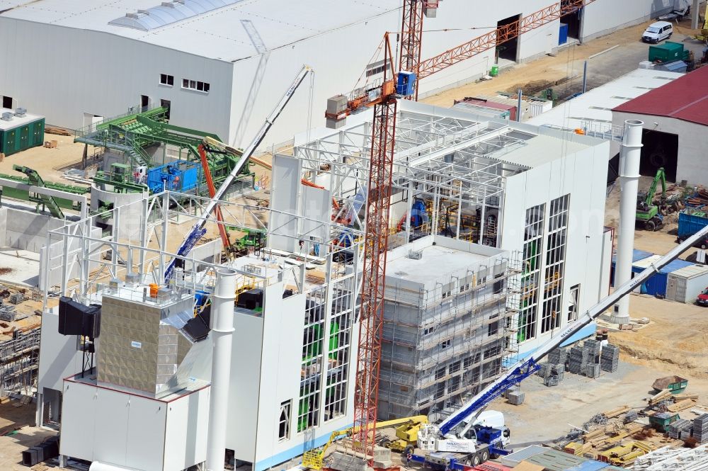 Aerial image Torgau - Construction site of a new build production facility for wood pellets in Torgau in the state Saxony