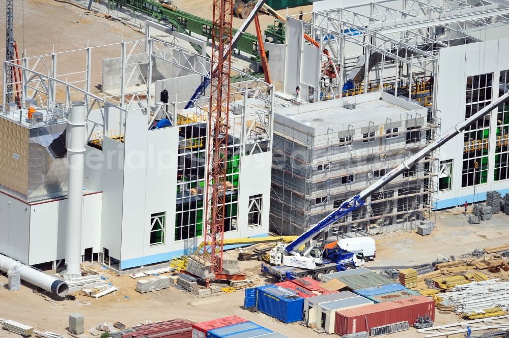 Aerial photograph Torgau - Construction site of a new build production facility for wood pellets in Torgau in the state Saxony