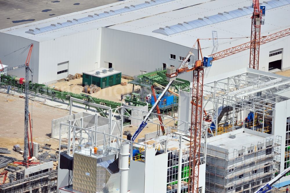 Torgau from the bird's eye view: Construction site of a new build production facility for wood pellets in Torgau in the state Saxony