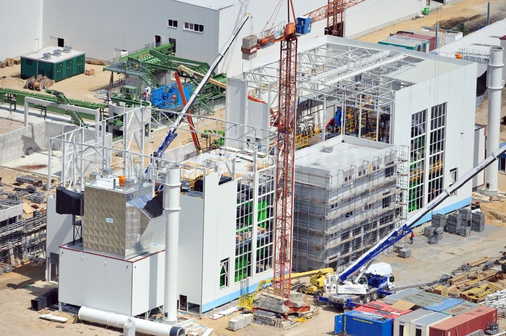 Aerial image Torgau - Construction site of a new build production facility for wood pellets in Torgau in the state Saxony