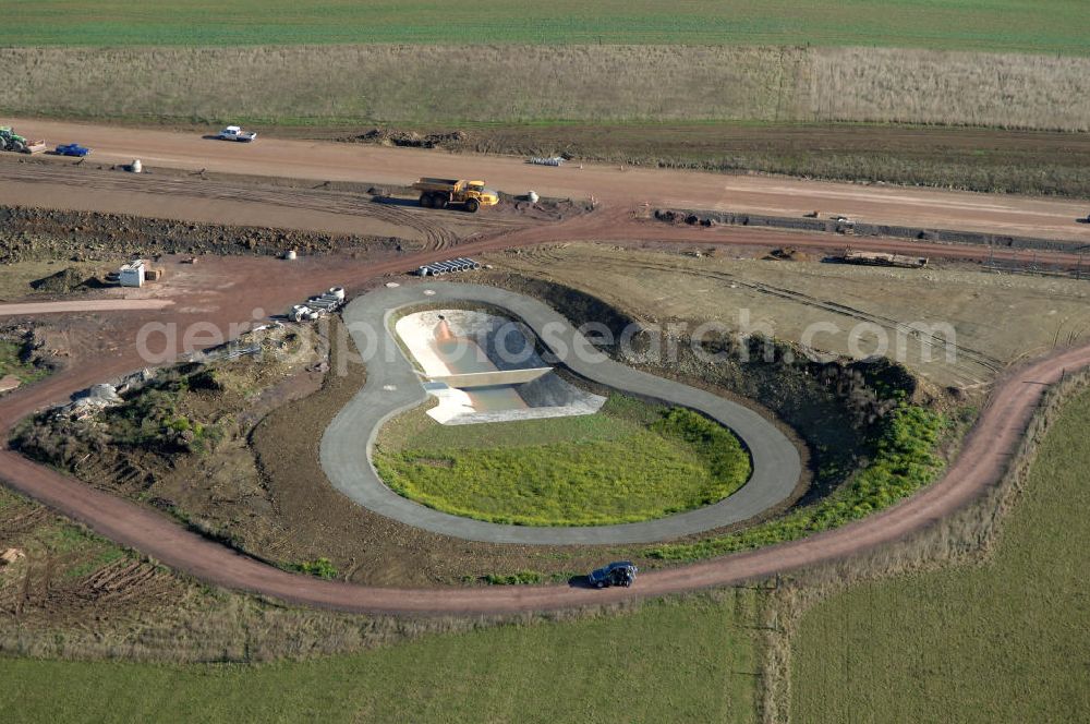 Ettenhausen from the bird's eye view: Blick auf die Baustelle eines Regenrückhaltebecken südlich der neuen Nessetalbrücke. Das Rückhaltebecken ist Teil des Projekt Nordverlegung / Umfahrung Hörselberge der Autobahn E40 / A4 in Thüringen bei Eisenach. Durchgeführt werden die im Zuge dieses Projektes notwendigen Arbeiten unter an derem von den Mitarbeitern der Niederlassung Weimar der EUROVIA Verkehrsbau Union sowie der Niederlassungen Abbruch und Erdbau, Betonstraßenbau, Ingenieurbau und TECO Schallschutz der EUROVIA Beto??????????????????