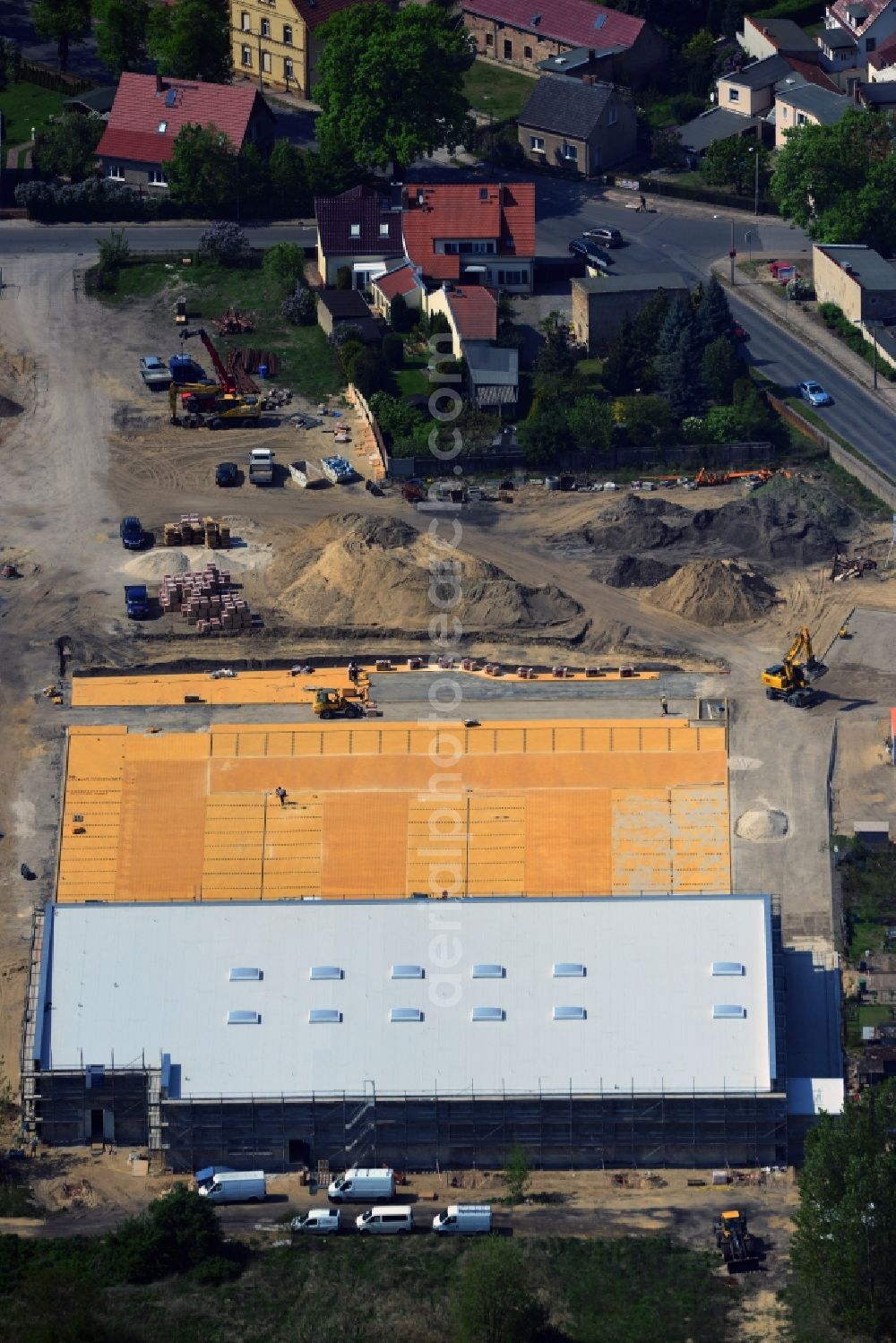 Schwielowsee-Caputh from the bird's eye view: In the district Caputh the community Schwielow a new REWE market is currently being built in the Friedrich-Ebert-Strasse. The supermarket will be the first building block of the new flower district