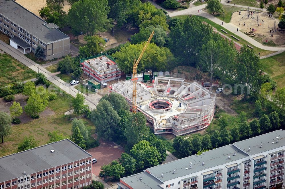 Aerial photograph Berlin - Construction site and building shell of a building between Peter Huchel St. and Erich Kästner St. in Berlin Hellersdorf