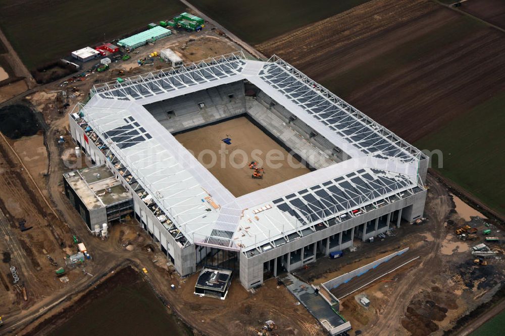 Aerial image Mainz - Die Rohbau- Baustelle der Coface-Arena, die als neues Stadion für den Fußballverein FSV Mainz 05 dienen soll. Derzeit werden am Rohbau Photovoltaikanlagen montiert, das Sportstättenprojekt soll 2011 abgeschlossen werden. Bauherr und Eigentümerin des Neubauprojektes ist die stadteigene Grundstücksverwaltungsgesellschaft der Stadt Mainz mbH (GVG). View to the building area of the new football stadium Coface-Arena in Mainz.