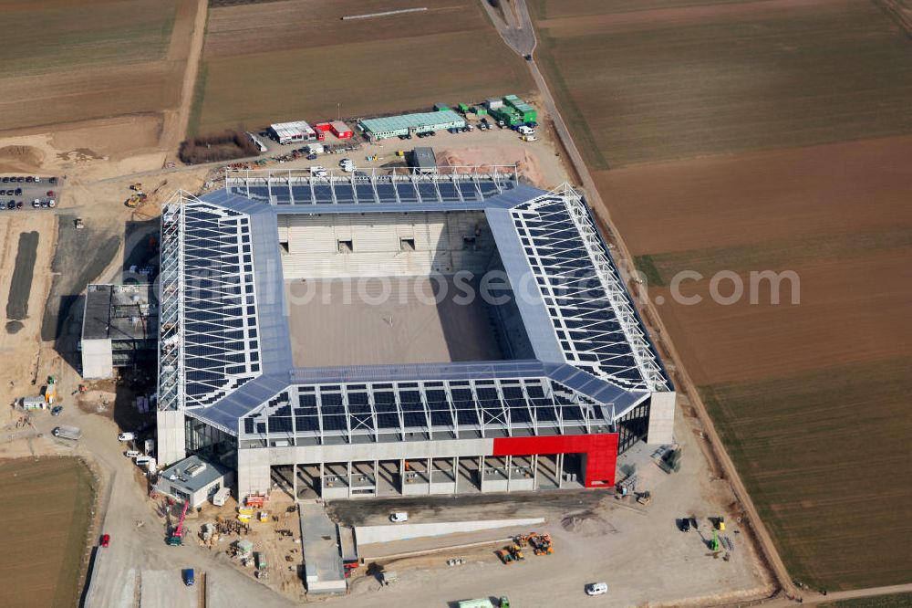 Mainz from the bird's eye view: Die Rohbau- Baustelle der Coface-Arena, die als neues Stadion für den Fußballverein FSV Mainz 05 dienen soll. Derzeit werden am Rohbau Photovoltaikanlagen montiert, das Sportstättenprojekt soll 2011 abgeschlossen werden. Bauherr und Eigentümerin des Neubauprojektes ist die stadteigene Grundstücksverwaltungsgesellschaft der Stadt Mainz mbH (GVG). View to the building area of the new football stadium Coface-Arena in Mainz.