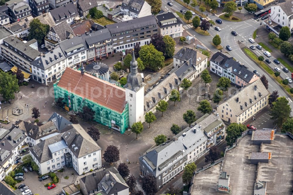 Meschede from above - Construction site for renovation and reconstruction work on the church building Kath. Pfarrkirche St. Walburga in Meschede in the state North Rhine-Westphalia, Germany