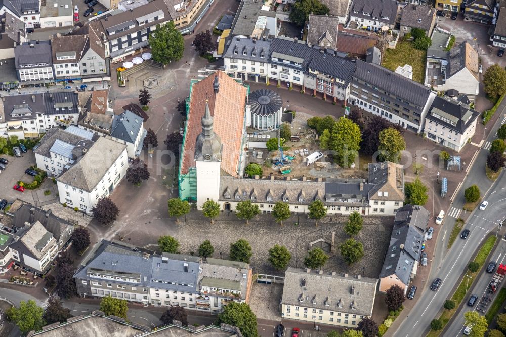 Meschede from the bird's eye view: Construction site for renovation and reconstruction work on the church building Kath. Pfarrkirche St. Walburga in Meschede in the state North Rhine-Westphalia, Germany