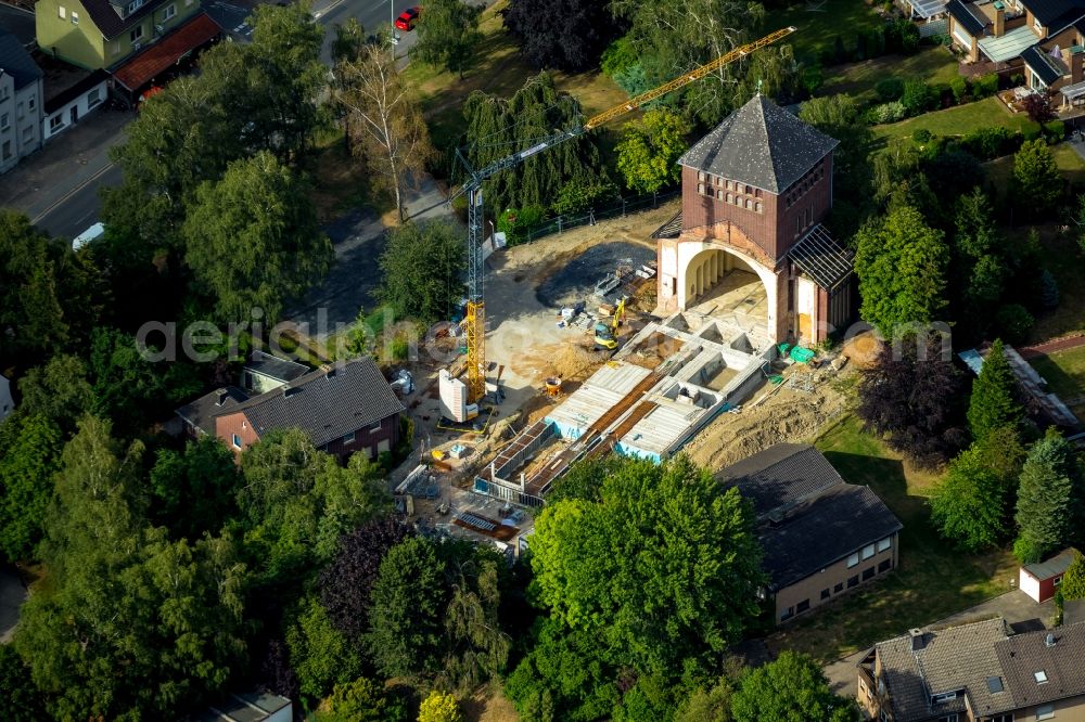 Werne from the bird's eye view: Construction site for renovation and reconstruction work on the church building kath. Kirche St. Konrad Stockumer Strasse in Werne in the state North Rhine-Westphalia, Germany