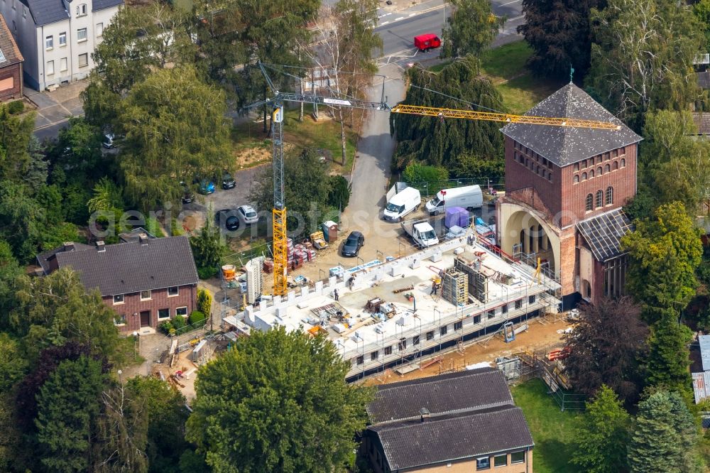 Aerial photograph Werne - Construction site for renovation and reconstruction work on the church building kath. Kirche St. Konrad Stockumer Strasse in Werne in the state North Rhine-Westphalia, Germany