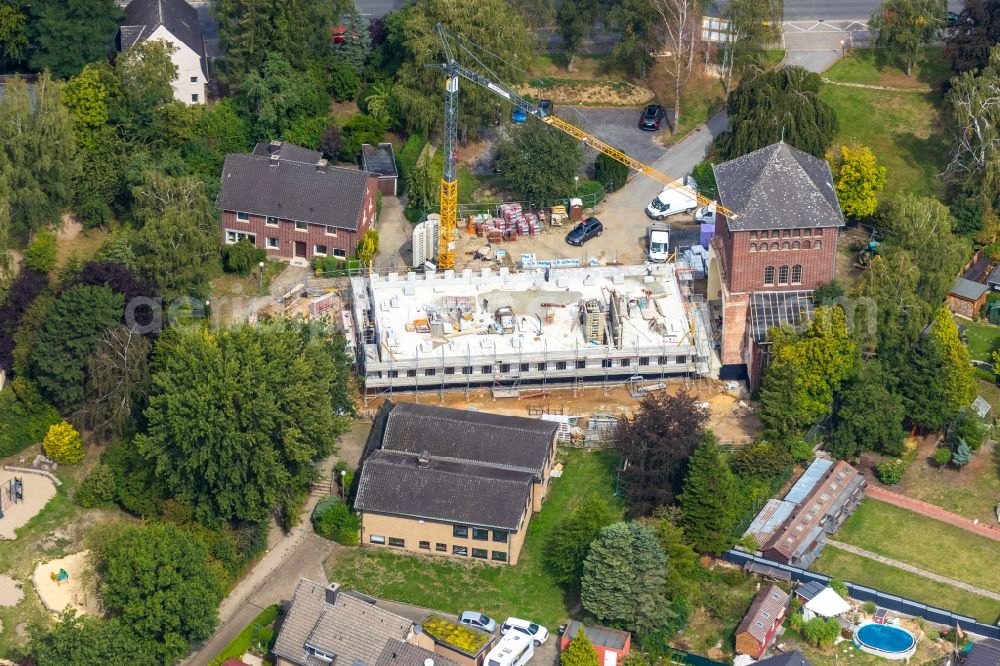 Werne from above - Construction site for renovation and reconstruction work on the church building kath. Kirche St. Konrad Stockumer Strasse in Werne in the state North Rhine-Westphalia, Germany