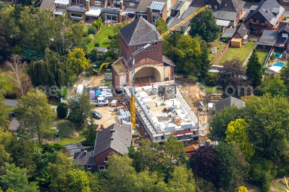 Werne from above - Construction site for renovation and reconstruction work on the church building kath. Kirche St. Konrad Stockumer Strasse in Werne in the state North Rhine-Westphalia, Germany