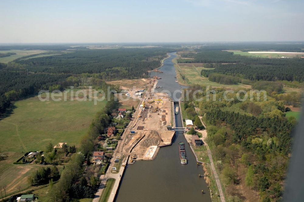 Aerial image WUSTERWITZ - Blick auf die Erweiterungsbaustelle Schleuse Wusterwitz am Elbe-Havel-Kanal. Im Rahmen des VDE Nr. 17 wird bei EHK km 376,8 neben der bereits bestehenden Schleuse Wusterwitz eine neue Südschleuse gebaut. Die 12,50 m breite Schleusenkammer hat eine nutzbare Kammerlänge von 190 m. Das Bauwerk erhält ein modernes und wirtschaftliches hydraulisches Seitenfüllsystem. Wusterwitz ist eine Gemeinde im brandenburgischen Landkreis Potsdam-Mittelmark. Sie ist Sitz des gleichnamigen Amtes, dem zudem die Gemeinden Rosenau und Bensdorf angehören. Auftraggeber und Kontakt: Wasser- und Schifffahrtsverwaltung des Bundes (WSV) im Geschäftsbereich des Bundesministeriums für Verkehr, Bau und Stadtentwicklung. Vertreten durch das Referat WS16, Verkehrstechnik, IT und Öffentlichkeitsarbeit in der Wasser- und Schifffahrtsverwaltung, Robert-Schuman-Platz 1, Postfach 20 01 00, 53170 Bonn; Kontakt Amt Wusterwitz: August-Bebel Strasse 10, 14789 Wusterwitz, Tel. +49 (0)33839 669 0, Fax +49 (0)33839 669 31, e-mail: amt-wusterwitz@t-online.de