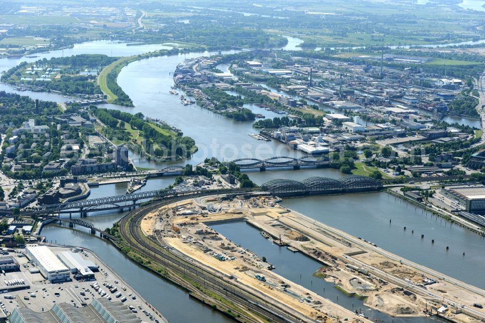 Hamburg from the bird's eye view: View of the construction site of the city development area Baakenhafen on the Elbe in Hamburg. Since the resolution of the Senate in 1998, the harbor and the surrounding headlands are formally part of the project HafenCity, where the port areas released south of the city center of Hamburg from its original use and to be converted to retail, commercial, residential and leisure-related areas