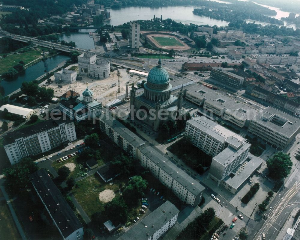 Aerial image Potsdam - The distinctive dome of St. Nicholas Church, the site of the Stadtschloss Potsdam seat of the Parliament of Brandenburg on the banks of the Havel, the Fachhochschule Potsdam with the departments of Information Sciences and Social Services, the Knobelsdorffstrasse House and the Obelisk in the Old Market in Potsdam in Brandenburg. In the background, a sports field and the Mercure Hotel Potsdam