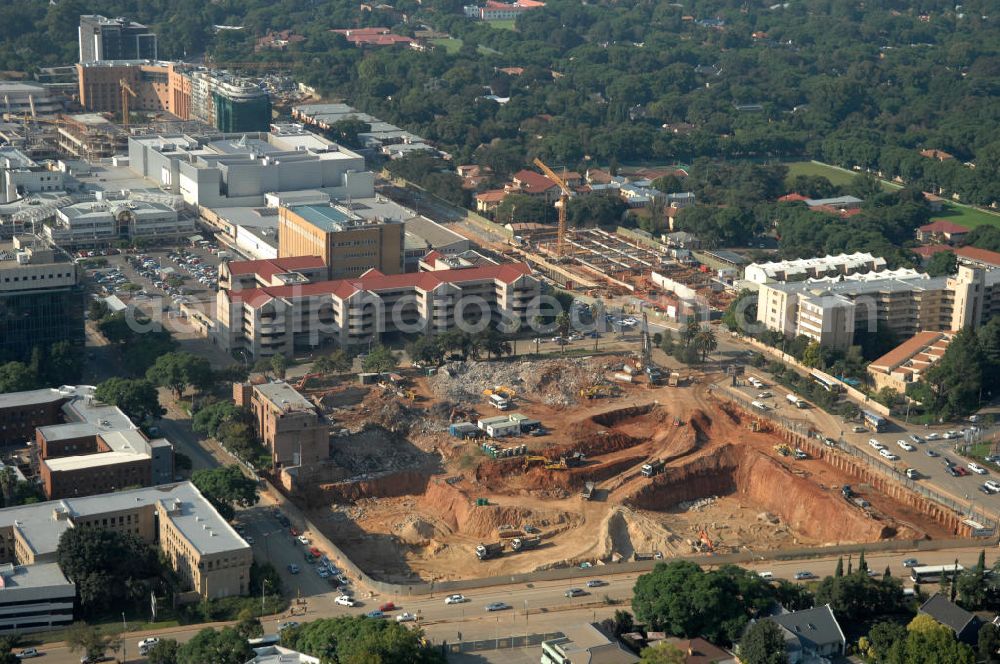 Aerial photograph JOHANNESBURG - Construction site in the district of Rosebank on the corner of Oxford Road / Baker Straat in Johannesburg, South Africa. Rosebank is well known for its large shopping center, the Mall of Rosebank