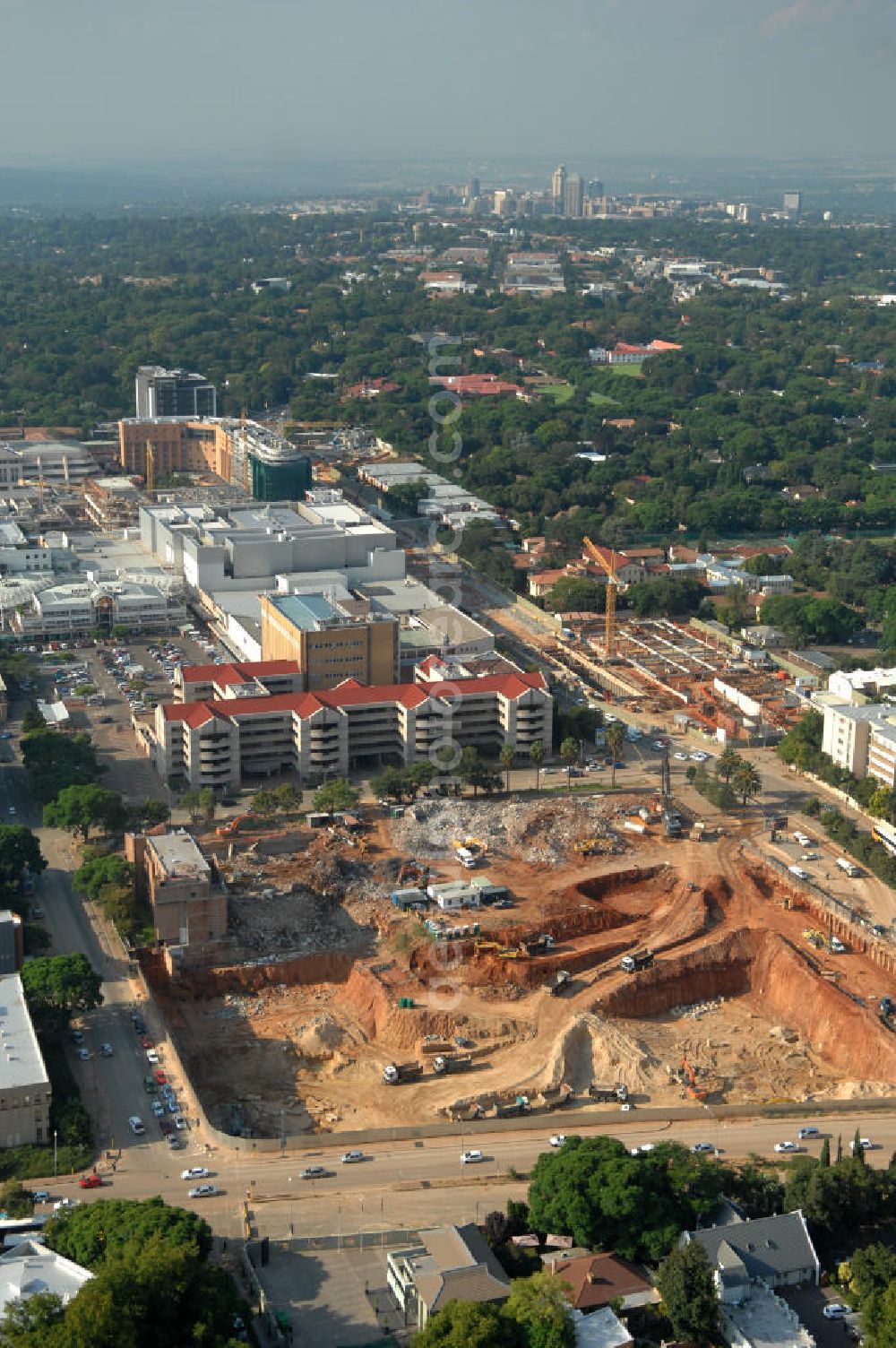 JOHANNESBURG from the bird's eye view: Construction site in the district of Rosebank on the corner of Oxford Road / Baker Straat in Johannesburg, South Africa. Rosebank is well known for its large shopping center, the Mall of Rosebank