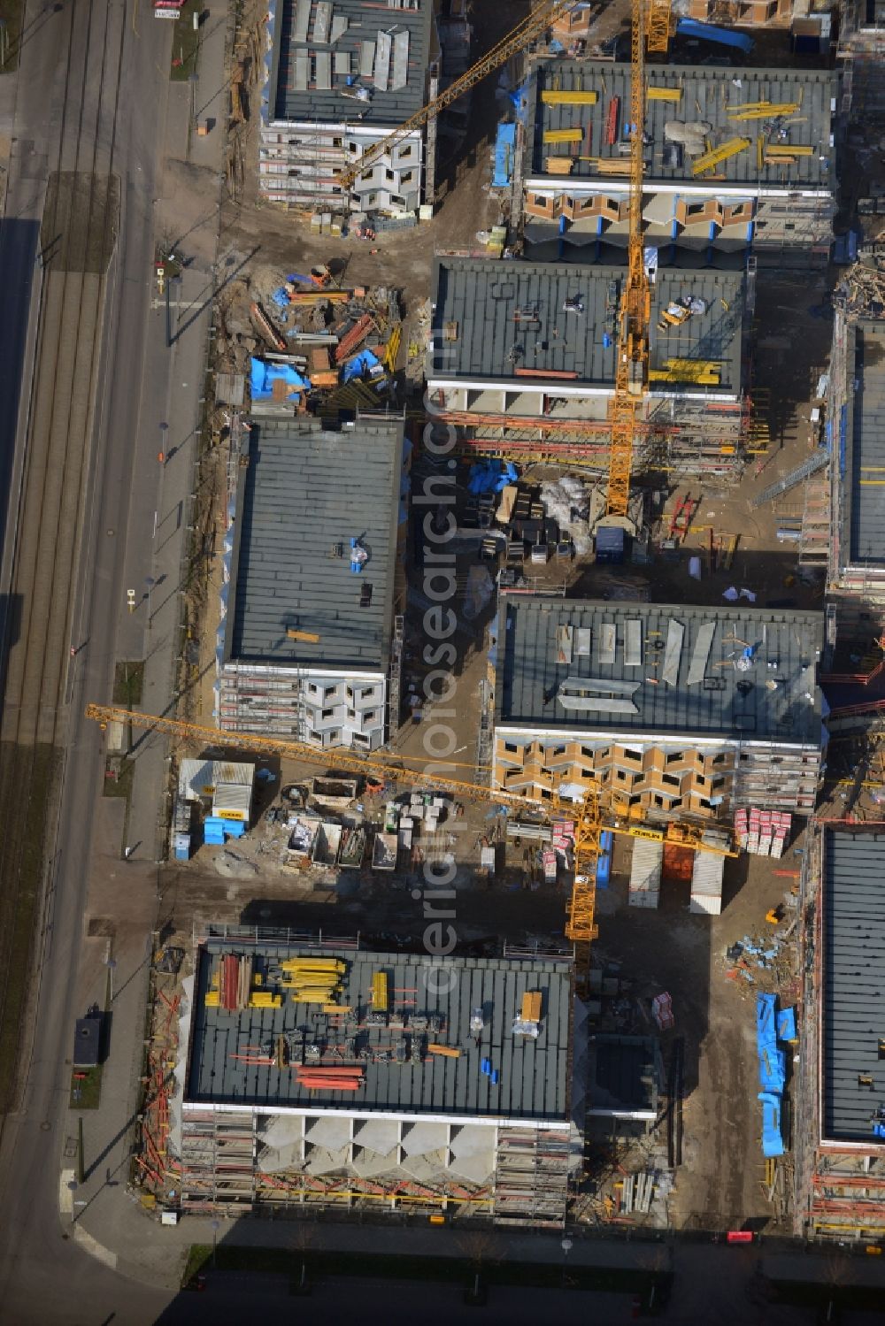 Berlin-Adlershof from above - Zueblin AG is currently building on behalf of the Students Schlachtensee eG in Science Campus Adlershof at the Karl-Ziegler-Strasse student village. The 380 residential units for students in 10 houses will be completed in summer 2014. The special feature of the student village are the common areas like the living room and kitchen, which group the individual floors of the residential landscape