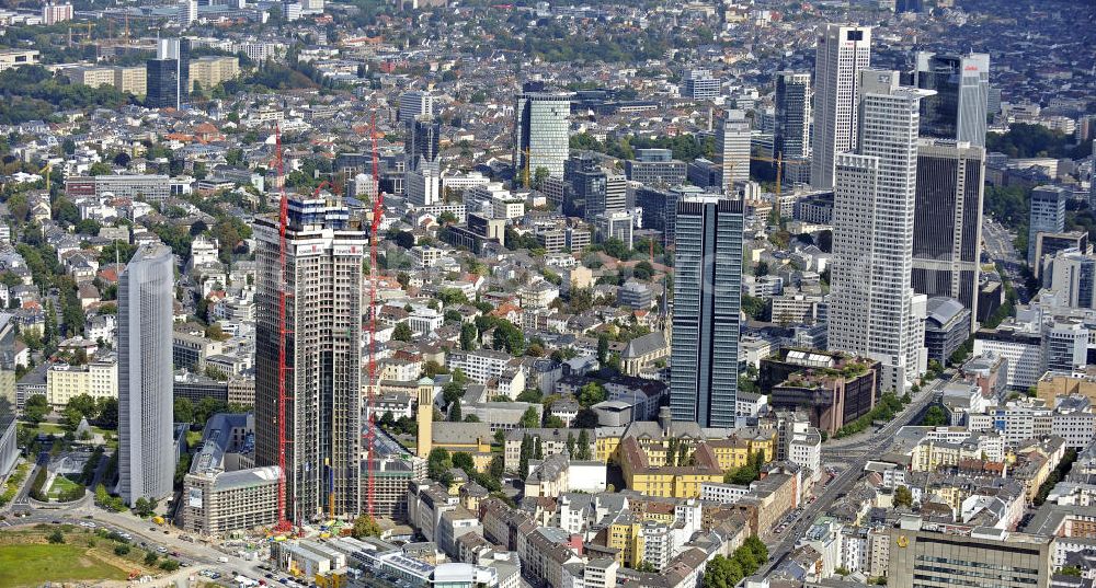 Aerial photograph Frankfurt am Main - Blick auf die Baustelle des Tower 185 , dem derzeit höchstem, in Deutschland im Bau befindlichen Wolkenkratzer. Bauherr ist die Vivico Real Estate. Die Wirtschaftsprüfungsgesellschaft PricewaterhouseCoopers (PwC) hat bereits vor Baubeginn 60.000 Quadratmeter von insgesamt rund 90.000 Quadratmeter Bürofläche langfristig angemietet und wird hier ihre neue Deutschland-Zentrale beziehen. Den Entwurf für den Tower 185 lieferte der Frankfurter Architekt Christoph Mäckler. Er sieht ein hufeisenförmig angelegtes Sockelgebäude vor, aus dem sich die beiden Hochhaushälften mit einer Aluminium-Glas-Fassade erheben. View of the construction site of Tower 185, currently the highest skyscraper in Germany under construction. Owner is the Vivico real estate.