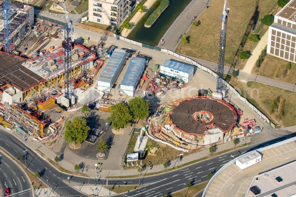 Essen from the bird's eye view: Construction site for the office building of Funke Media Group on Berliner Platz in Essen in the state of North Rhine-Westphalia. Executing construction company is Hochtief Aktiengesellschaft