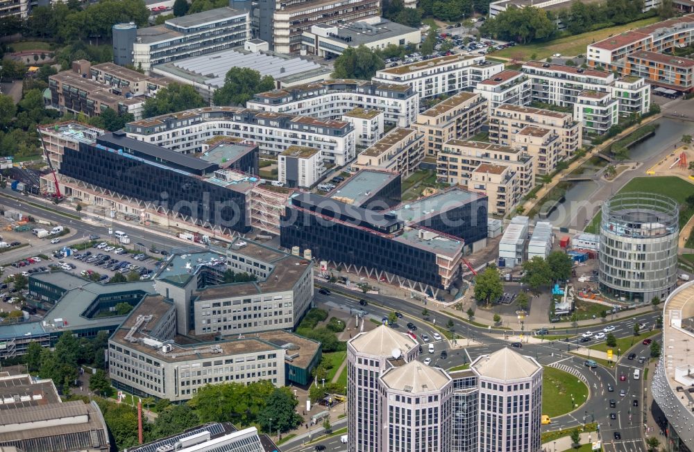 Essen from the bird's eye view: Construction site for the office building of Funke Media Group on Berliner Platz in Essen in the state of North Rhine-Westphalia. Executing construction company is Hochtief Aktiengesellschaft