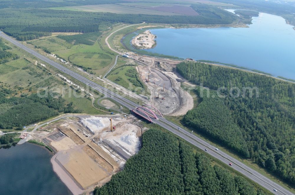 Zwenkau from the bird's eye view: Construction Iste of new build connecting cannel Harthkanal between the Lake Zwenkau and Lake Cospuden with the leading highway bridge of the federal motorway A38 in Zwenkau in Saxony