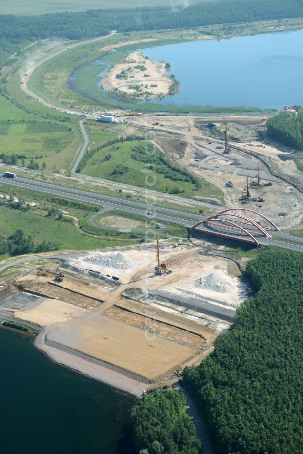 Zwenkau from the bird's eye view: Construction Iste of new build connecting cannel Harthkanal between the Lake Zwenkau and Lake Cospuden with the leading highway bridge of the federal motorway A38 in Zwenkau in Saxony