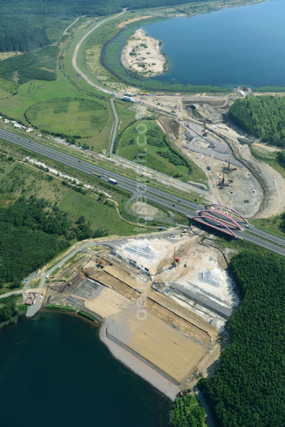 Zwenkau from the bird's eye view: Construction Iste of new build connecting cannel Harthkanal between the Lake Zwenkau and Lake Cospuden with the leading highway bridge of the federal motorway A38 in Zwenkau in Saxony