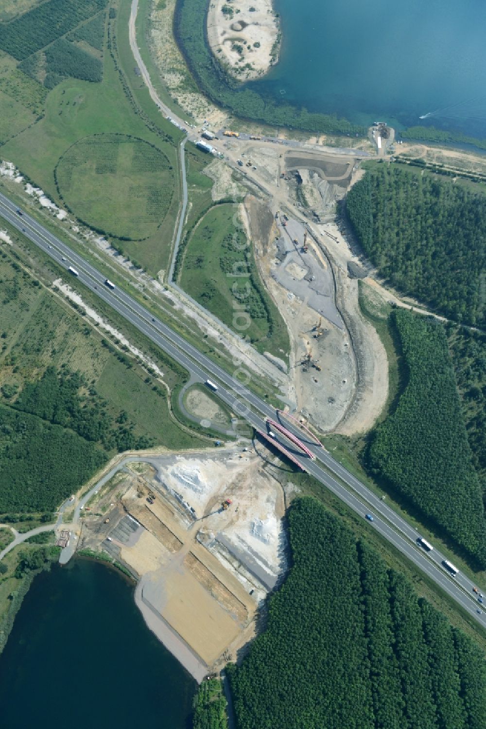 Zwenkau from the bird's eye view: Construction Iste of new build connecting cannel Harthkanal between the Lake Zwenkau and Lake Cospuden with the leading highway bridge of the federal motorway A38 in Zwenkau in Saxony