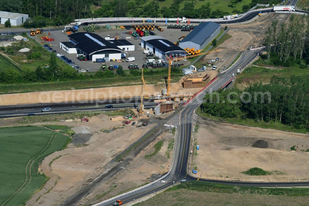 Fehrbellin from the bird's eye view: Construction site for the expansion of traffic flow on the motorway BAB A 24 in the district Tarmow in Fehrbellin in the state Brandenburg, Germany