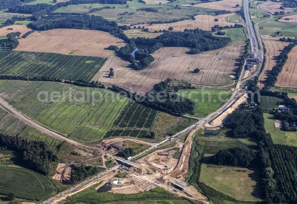 Löptin from the bird's eye view: Construction to extend the traffic flow at the intersection- motorway A 21 / B 404 in the district Tanneneck in Loeptin in the state Schleswig-Holstein