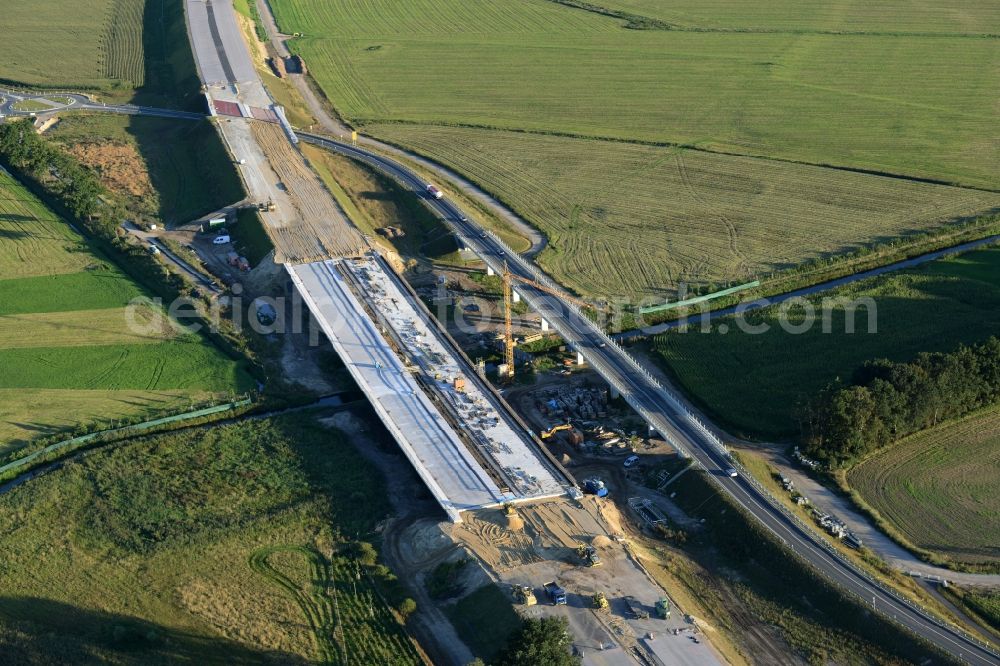 Karstädt from the bird's eye view: Construction site for the expansion of traffic flow on the state road L13 in Karstaedt in the state Brandenburg