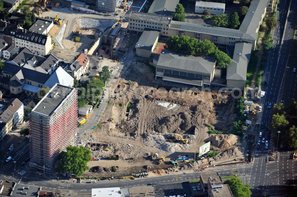 Köln from the bird's eye view: Baustelle von Hotels, Wohn- und Geschäftshäusern am Waidmarkt mit dem alten Polizeipräsidium, der Kirche St. Georg und dem Friedrich-Wilhelm-Gymnasium in Köln-Altstadt-Süd in Nordrhein-Westfalen. Construction area of hotels, tenements and business buildings at Waidmarkt with former police headquarters, church St. Georg and school Friedrich-Wilhelm-Gymnasium in southern historic district of Cologne, North Rhine-Westphalia. Bauträger: