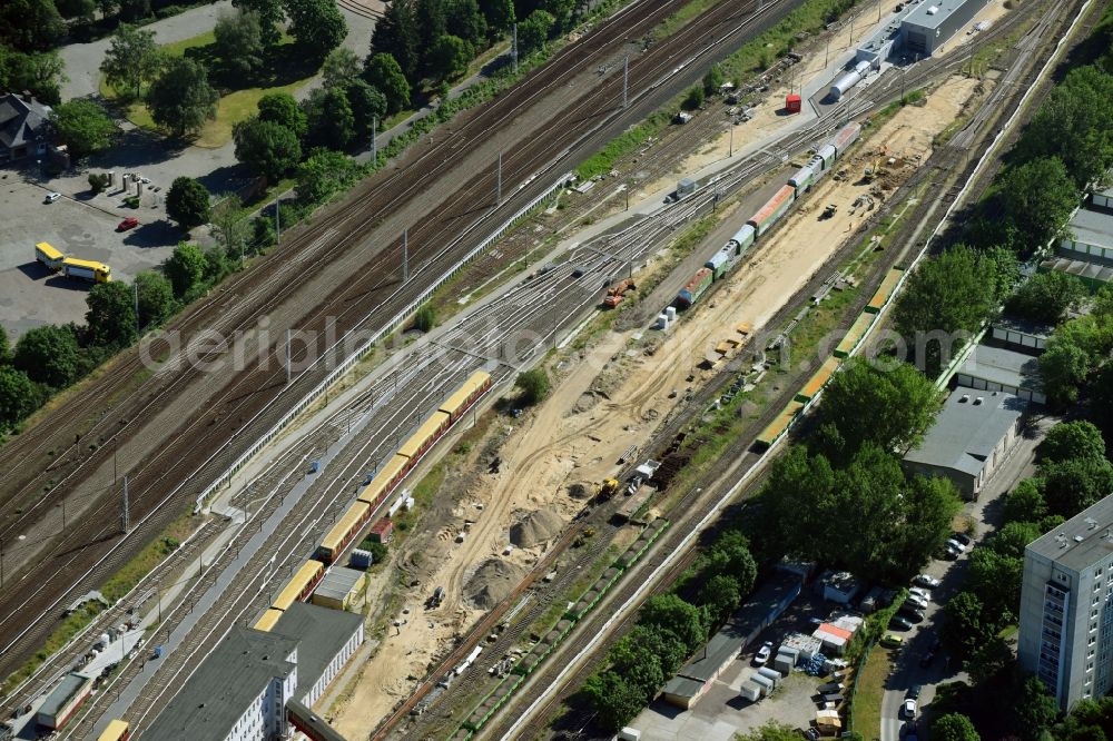 Berlin from above - Maintenance work on a rail track and overhead wiring harness in the route network of the Deutsche Bahn in the district Lichtenberg in Berlin, Germany