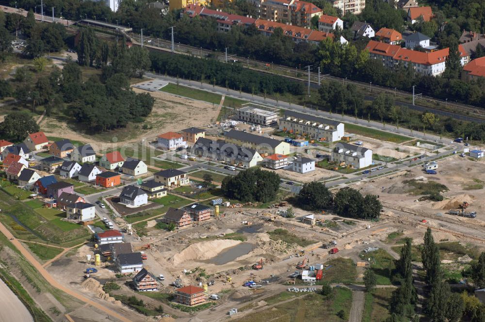 Aerial image Berlin - Blick auf die Baustelle der Wohnanlage Carlsgarten in Berlin Karlshorst. Karlshorst liegt auf halbem Weg zwischen Berlin-Mitte und dem Erholungsgebiet Müggelsee. Die Häuser entstehen in unmittelbarer Nähe zum Volks- und Waldpark Wuhlheide mit dem Freizeit- und Erholungszentrum (FEZ) und der Trabrennbahn. Bauherr ist die NCC Deutschland GmbH. Kontakt: NCC Deutschland GmbH, Herr Helmut Kunze, Treskowallee 115, 10318 Berlin. Telefon Info-Line: 0800/670 00 00.