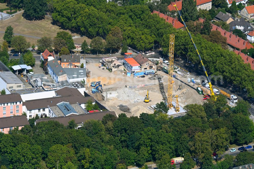 Aerial image Berlin - Construction site for the new construction of the building complex of a residential complex with an integrated local supply center on street Roedernallee - Alt-Wittenau in the district Wittenau in Berlin, Germany