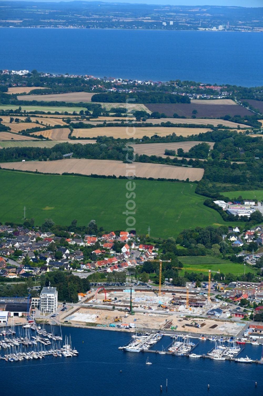 Travemünde from the bird's eye view: Residential construction site with multi-family housing development- on the Auf dem Baggersand in Travemuende in the state Schleswig-Holstein, Germany