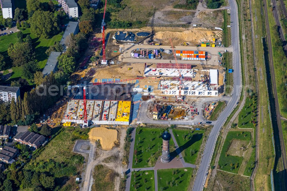 Duisburg from the bird's eye view: Residential area construction site with multi-family housing development - new building at the old water tower of the former railway site on Dirschauer Weg in the Wedau district of Duisburg in the Ruhr area in the state of North Rhine-Westphalia, Germany