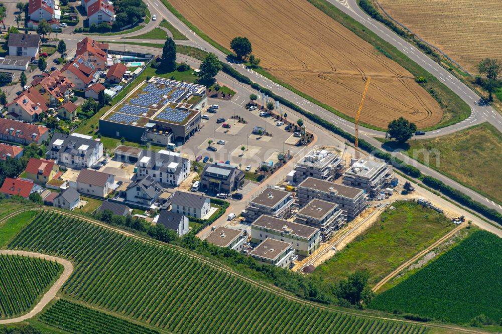 Aerial photograph Malterdingen - Residential construction site with multi-family housing development- and Einkaufsmarkt on street Im Kleb in Malterdingen in the state Baden-Wuerttemberg, Germany