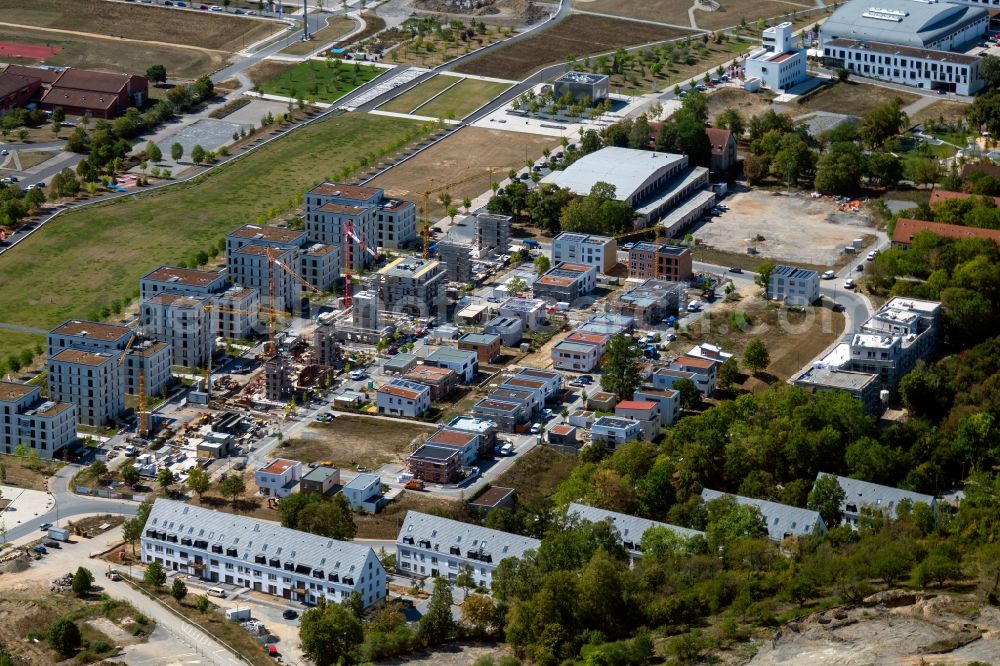 Würzburg from the bird's eye view: Residential construction site with multi-family housing development- on the along the Norbert-Glanzberg-strasse in Wuerzburg in the state Bavaria, Germany Two larger buildings were built by the construction community Wuerzburg GbR and planned for the companies bogevischs buero architekten & stadtplaner GmbH and bauart Konstruktions GmbH + Co. KG, and more of the INDUSTRIA WOHNEN GmbH are to be built here