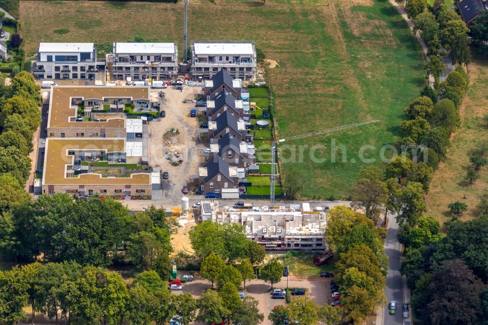 Aerial photograph Hamminkeln - Residential construction site with multi-family housing development- on the Wohnen on Alten Sportplatz on Bruener Strasse in Hamminkeln in the state North Rhine-Westphalia, Germany