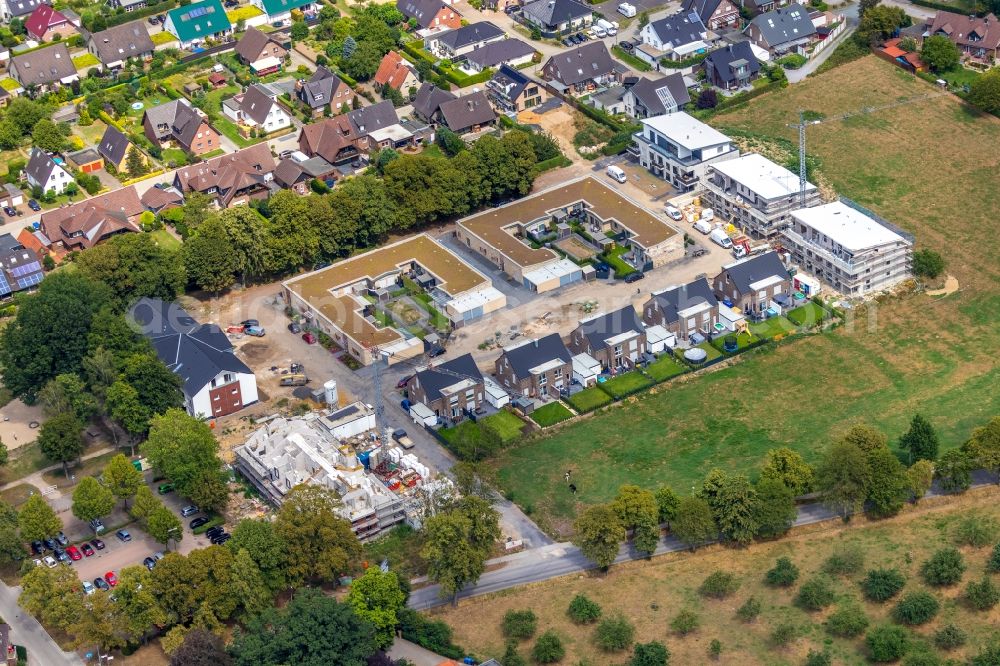 Hamminkeln from above - Residential construction site with multi-family housing development- on the Wohnen on Alten Sportplatz on Bruener Strasse in Hamminkeln in the state North Rhine-Westphalia, Germany