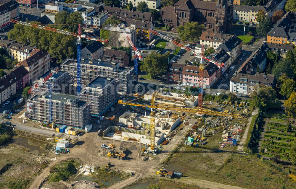 Essen from the bird's eye view: Residential construction site with multi-family housing development Wohnen on Krupp-Park next to the Quartier West shopping center on Husmannshofstrasse - Dickmannstrasse - Altendorfer Strasse in Essen at Ruhrgebiet in the state North Rhine-Westphalia, Germany