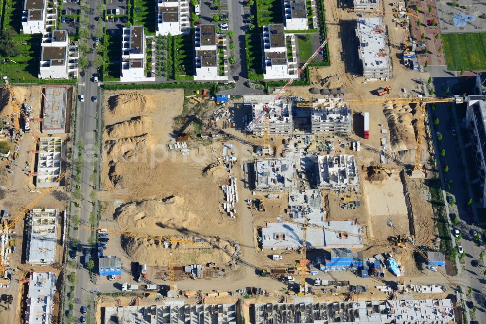 Berlin from above - Construction site and residential area Steglitzer ParkQuartier in the Lichterfelde part of the district of Steglitz-Zehlendorf in Berlin. New multi-family homes and estates are being developed on the site of the Square of the US-Berlin-Brigades which is surrounded by woods, green areas and playgrounds. It is developed by the Swedish Construction and Real Estate Company NCC AB