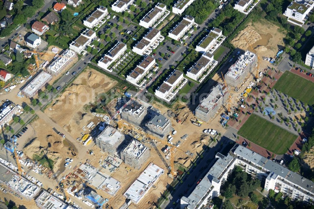 Aerial image Berlin - Construction site and residential area Steglitzer ParkQuartier in the Lichterfelde part of the district of Steglitz-Zehlendorf in Berlin. New multi-family homes and estates are being developed on the site of the Square of the US-Berlin-Brigades which is surrounded by woods, green areas and playgrounds. It is developed by the Swedish Construction and Real Estate Company NCC AB