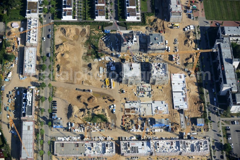 Berlin from above - Construction site and residential area Steglitzer ParkQuartier in the Lichterfelde part of the district of Steglitz-Zehlendorf in Berlin. New multi-family homes and estates are being developed on the site of the Square of the US-Berlin-Brigades which is surrounded by woods, green areas and playgrounds. It is developed by the Swedish Construction and Real Estate Company NCC AB