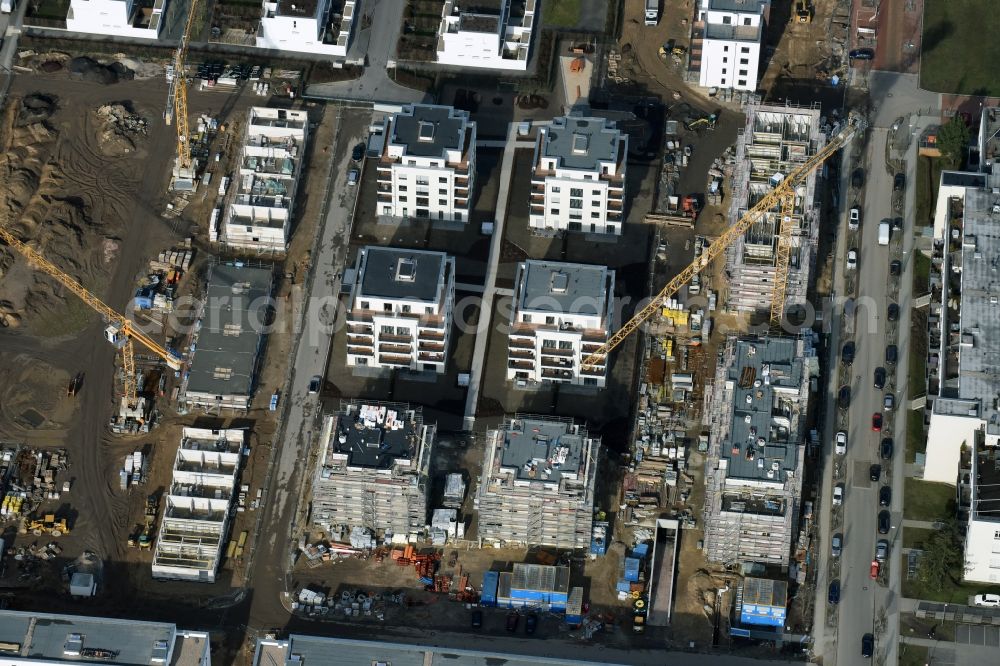 Aerial photograph Berlin - Construction site and residential area Steglitzer ParkQuartier in the Lichterfelde part of the district of Steglitz-Zehlendorf in Berlin. New multi-family homes and estates are being developed on the site of the Square of the US-Berlin-Brigades which is surrounded by woods, green areas and playgrounds. It is developed by the Swedish Construction and Real Estate Company NCC AB