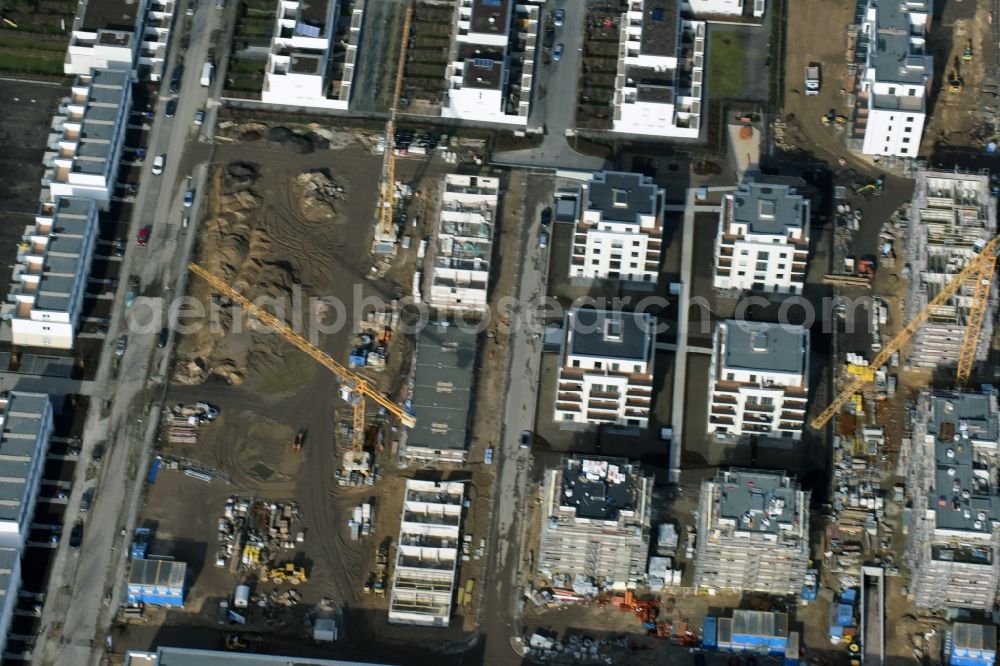 Berlin from above - Construction site and residential area Steglitzer ParkQuartier in the Lichterfelde part of the district of Steglitz-Zehlendorf in Berlin. New multi-family homes and estates are being developed on the site of the Square of the US-Berlin-Brigades which is surrounded by woods, green areas and playgrounds. It is developed by the Swedish Construction and Real Estate Company NCC AB