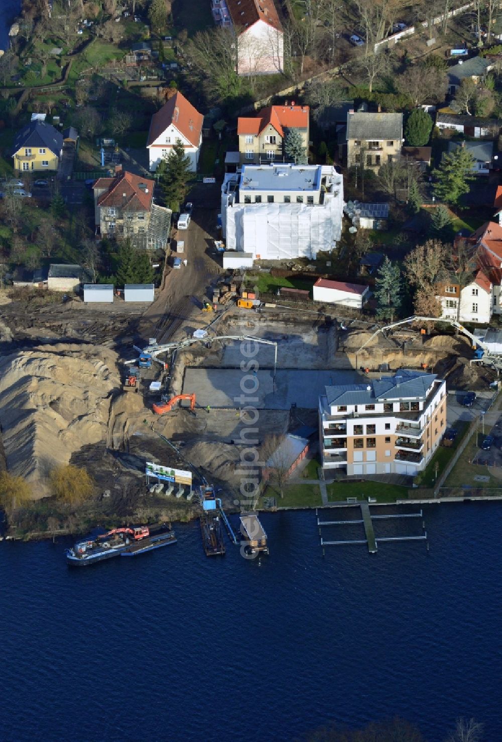 Berlin from the bird's eye view: Construction site to build a new residential area in the district Treptow-Koepenick in Berlin. The building is near the Neuenhagener Muehlenfliess and the Mueggelspree. The aera is next to the Salvador-Allende-Strasse