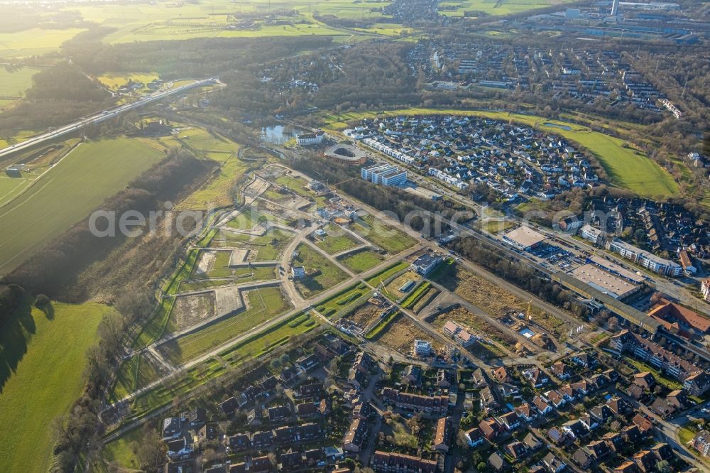 Duisburg from the bird's eye view: Residential area construction site of a mixed development with multi-family houses and single-family houses- New building at the Am Alten Angerbach in the district Huckingen in Duisburg at Ruhrgebiet in the state North Rhine-Westphalia, Germany